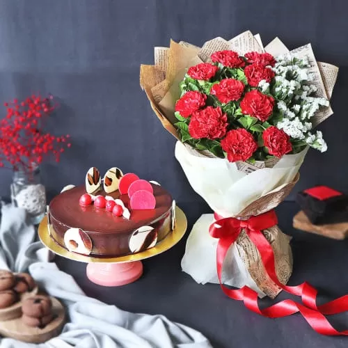 Elegant Truffle Cake With Bunch Of Red Carnations (Half kg) Elegant Truffle Cake With Bunch Of Red Carnations (Half kg)